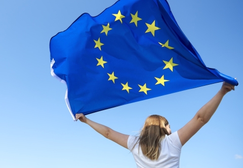 Girl holding EU flag