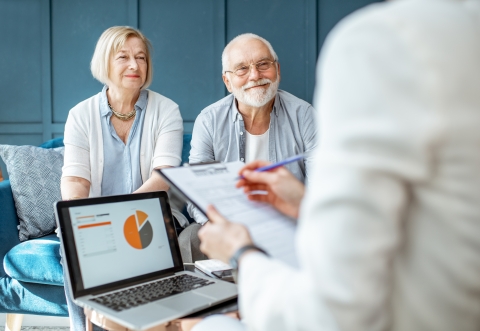 Smiling pensioners receiving advice